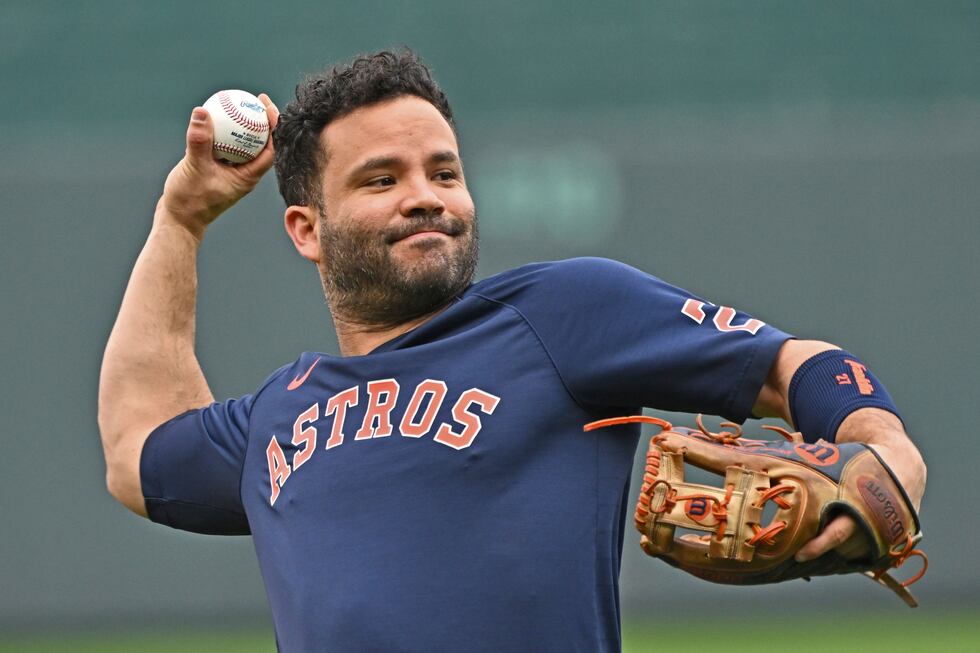 FILE - Houston Astros second baseman Jose Altuve throws during batting practice, before a...