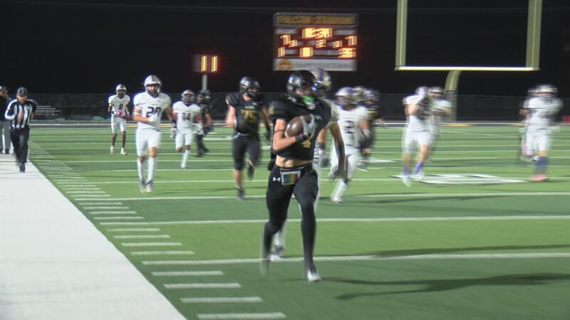 Bushland's Tanner Adams takes it down the sideline in route to a touchdown against Dalhart.