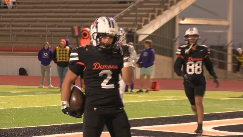 Dumas running back Luis Escarcega strikes a pose after punching in a Demons touchdown against...