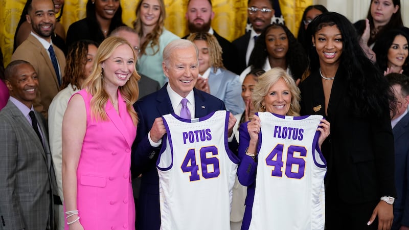 President Joe Biden and first lady Jill Biden are presented with jerseys by LSU women's...