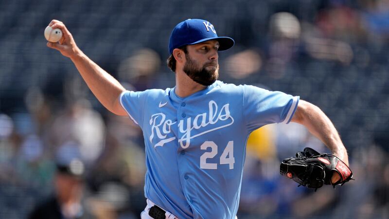 Kansas City Royals starting pitcher Jordan Lyles throws during the first inning of a baseball...