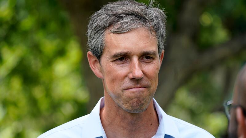 FILE - Democrat Beto O'Rourke listens to a volunteer before a Texas Organizing Project...