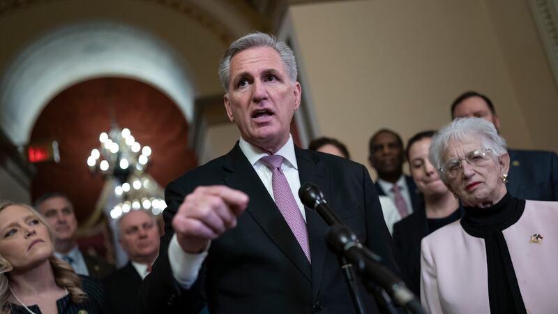 Speaker of the House Kevin McCarthy, R-Calif., joined at left by Rep. Erin Houchin, R-Ind.,...