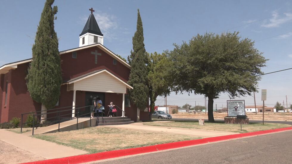 Church members visit after a service at Mt. Rose Full Gospel Baptist Church on Aug. 26.