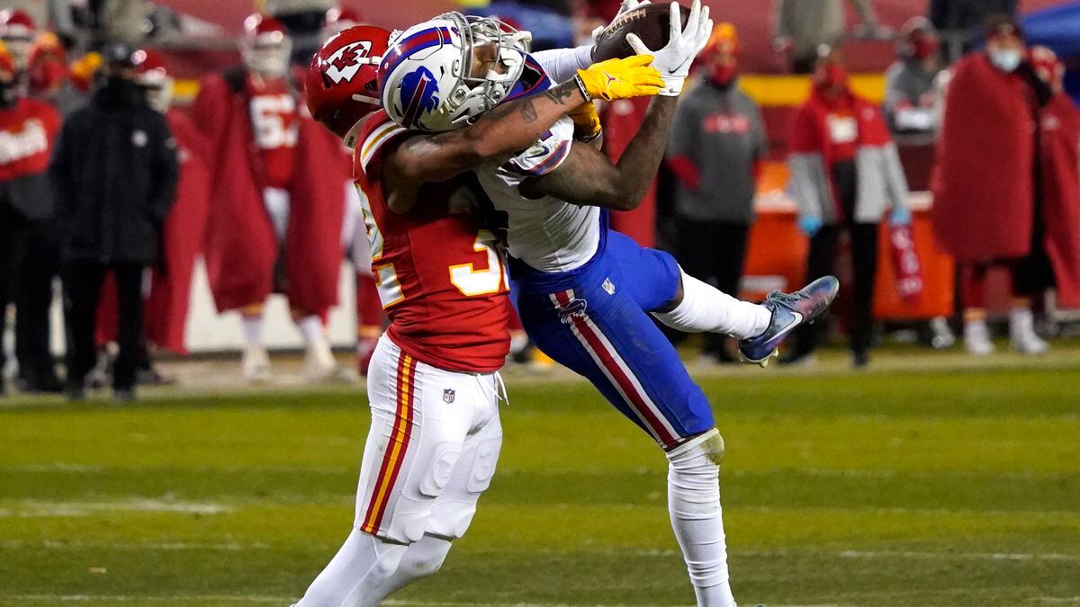 Buffalo Bills wide receiver Stefon Diggs is tackled by Kansas City Chiefs safety Tyrann...